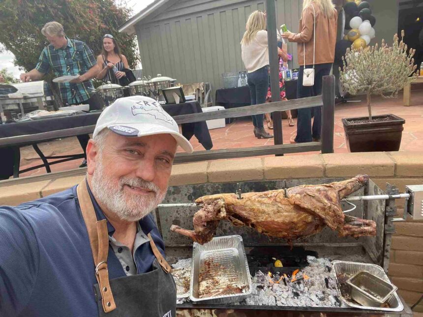 bob cooking lamb oon a spit